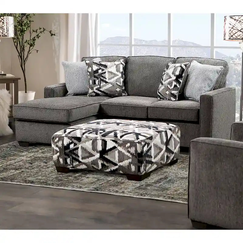 Pouf geometrico multicolore di transizione