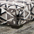 Pouf geometrico multicolore di transizione