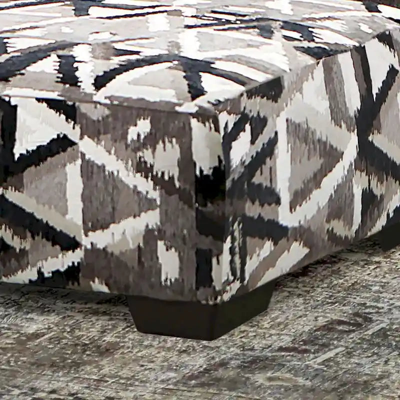 Pouf geometrico multicolore di transizione